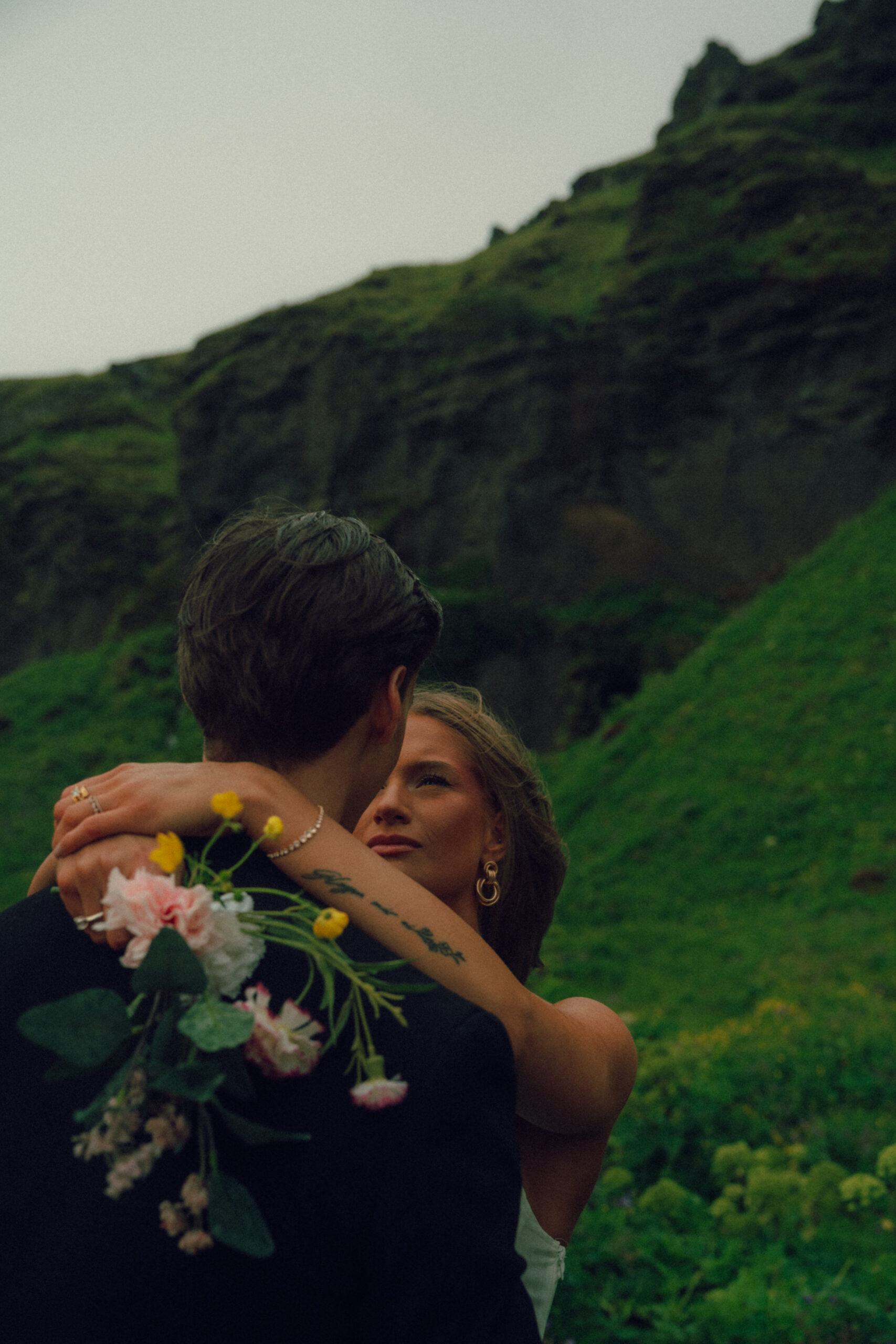 A cinematic portrait of a couple during their elopement in Iceland.