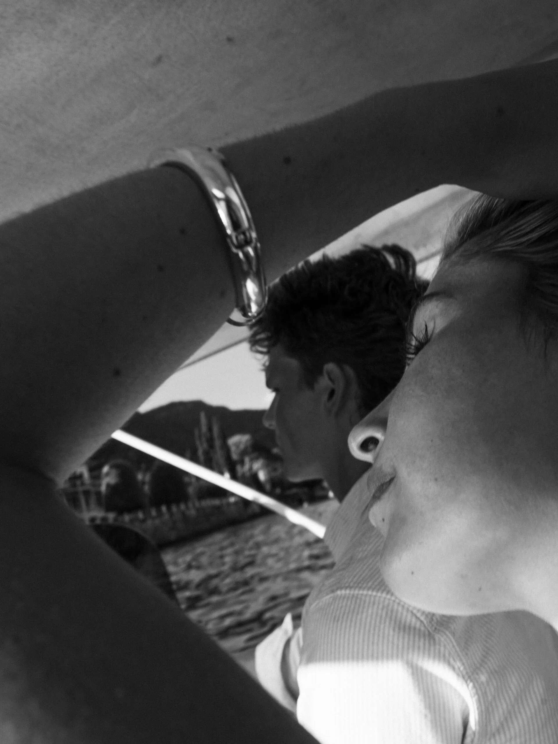 A cinematic photo of a couple posing in a yacht in Lake Como.
