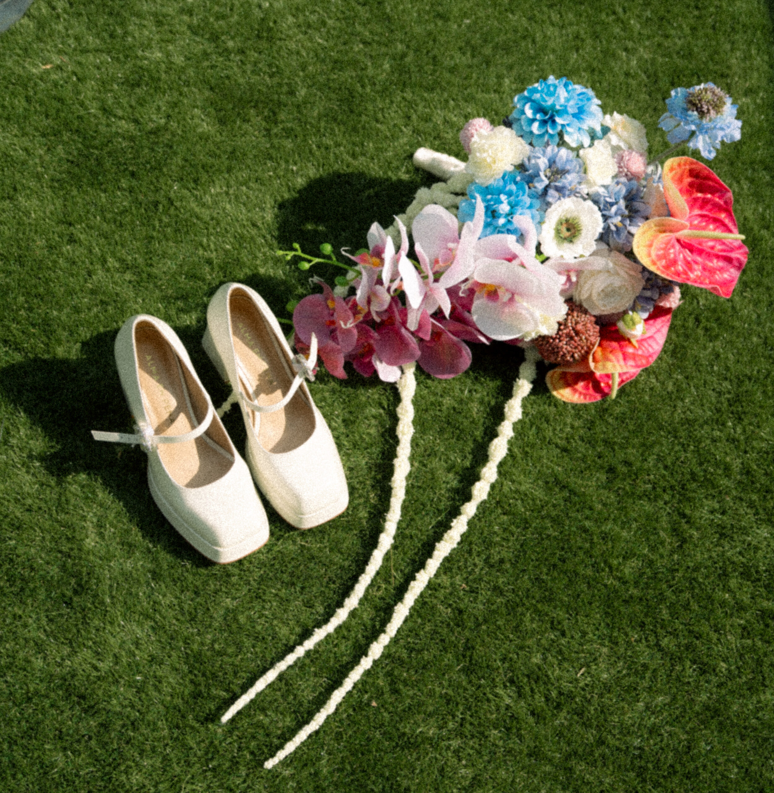 A wedding flat lay of shoes and bouquet of flowers in the Netherlands.