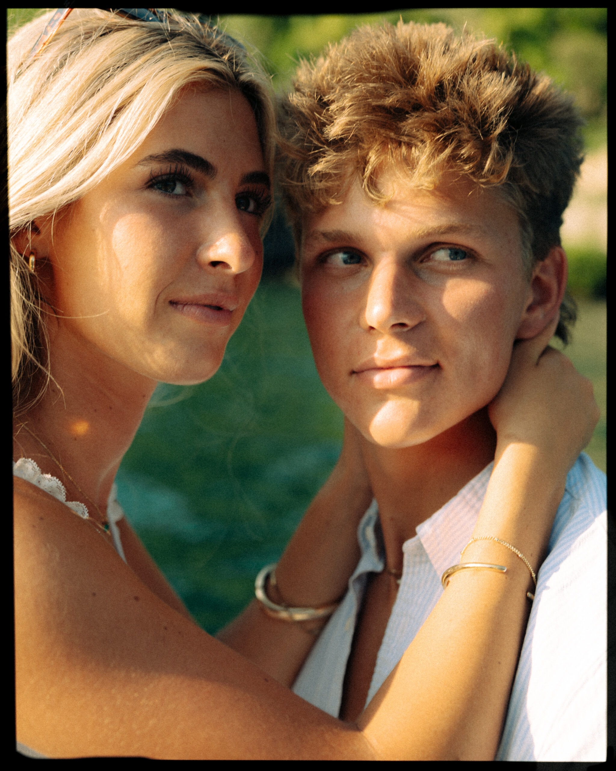 A cinematic photo of a couple posing in a boat in Lake Como.