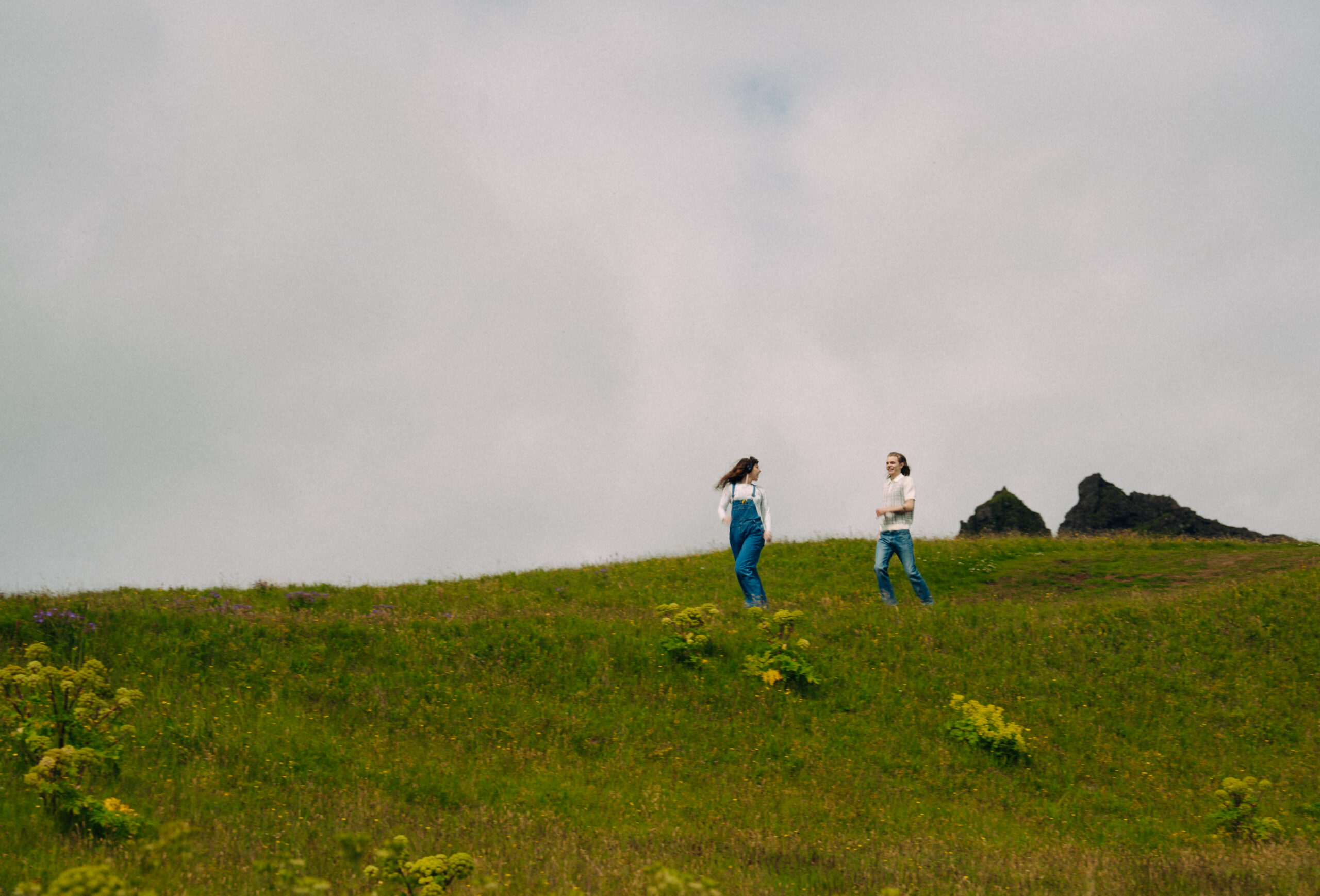 A cinematic photo of a couple posing in Vik, Iceland.
