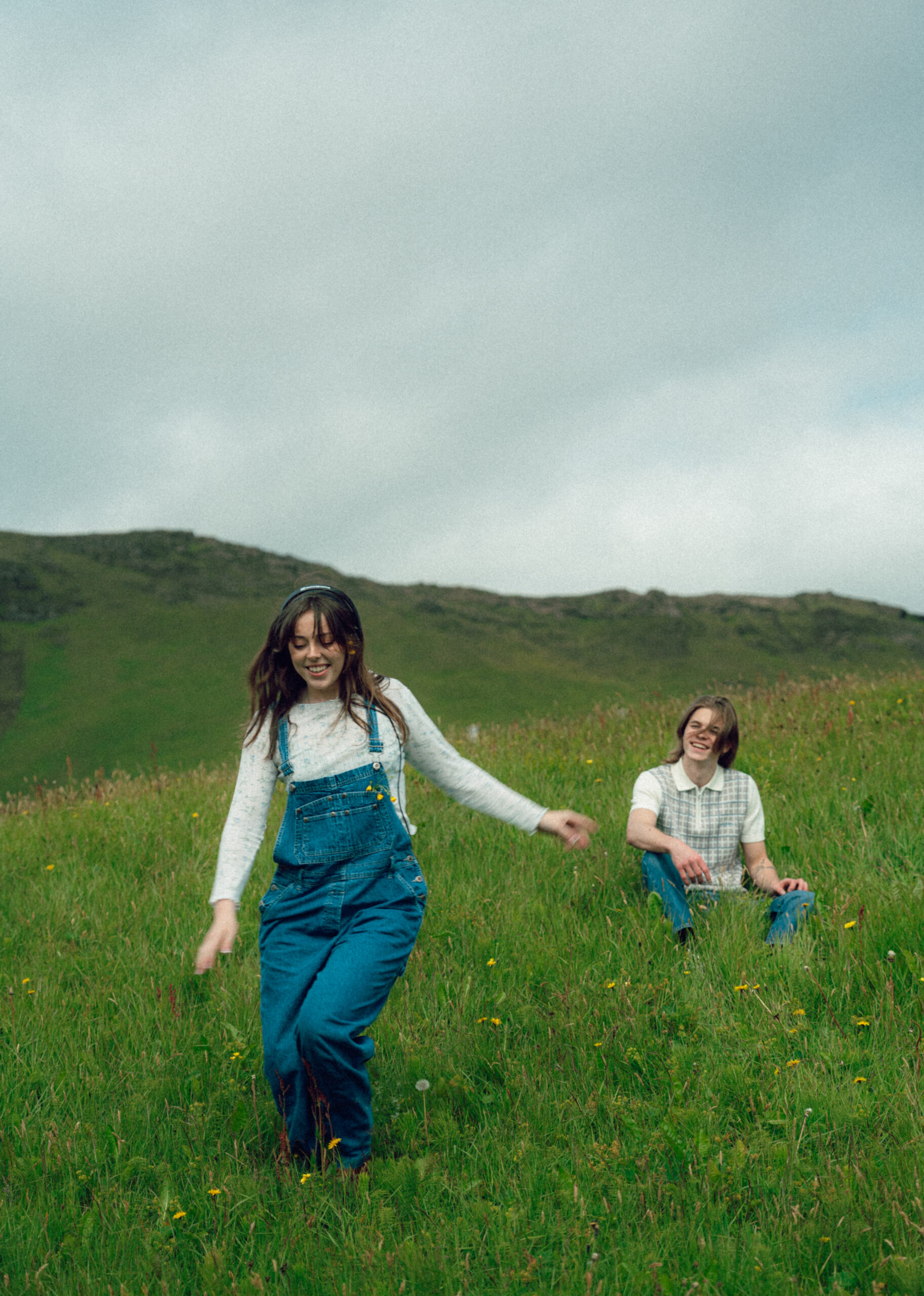 A cinematic photo of a couple posing in Vik, Iceland.