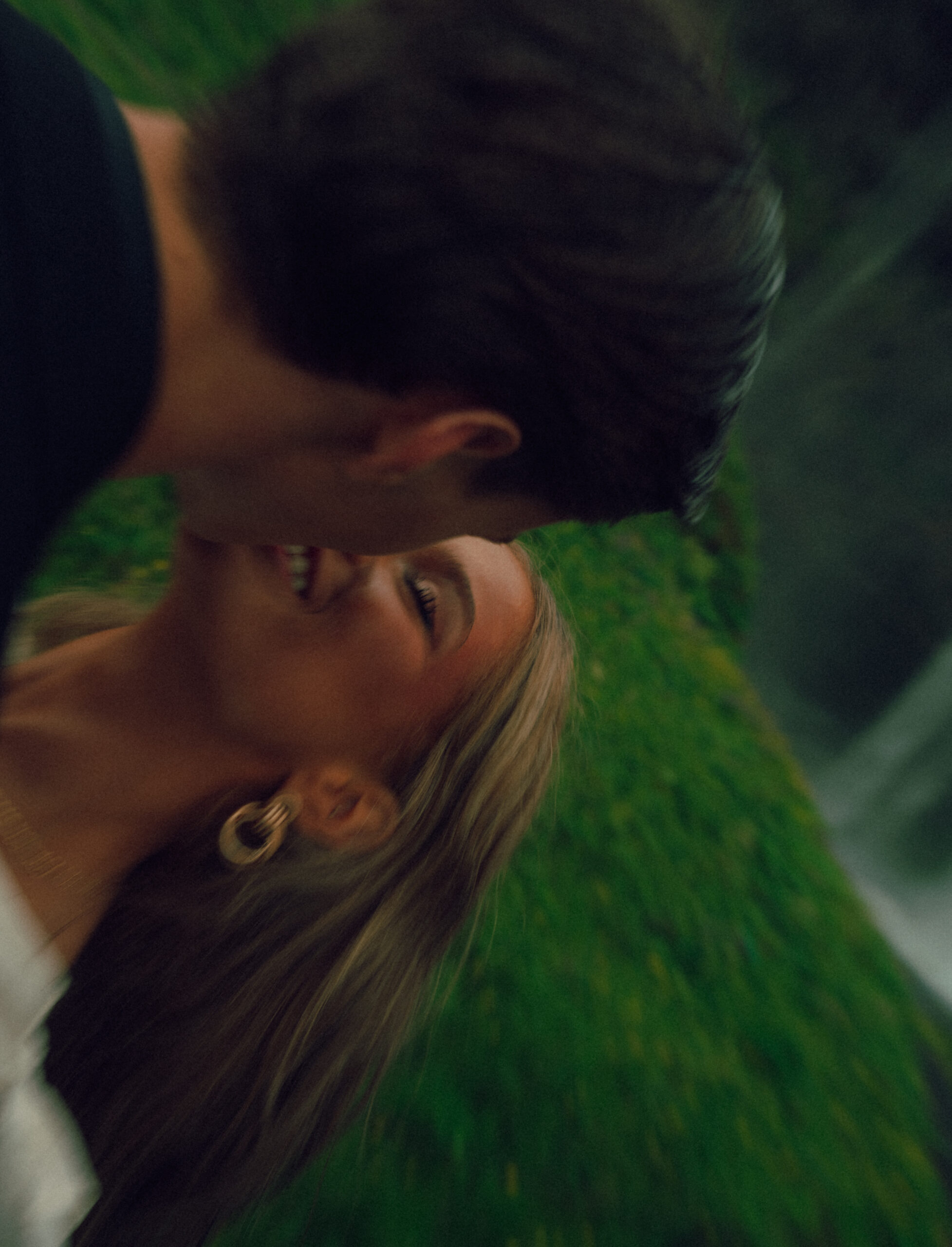 A cinematic photo of a couple in front of a waterfall during their elopement in Iceland.