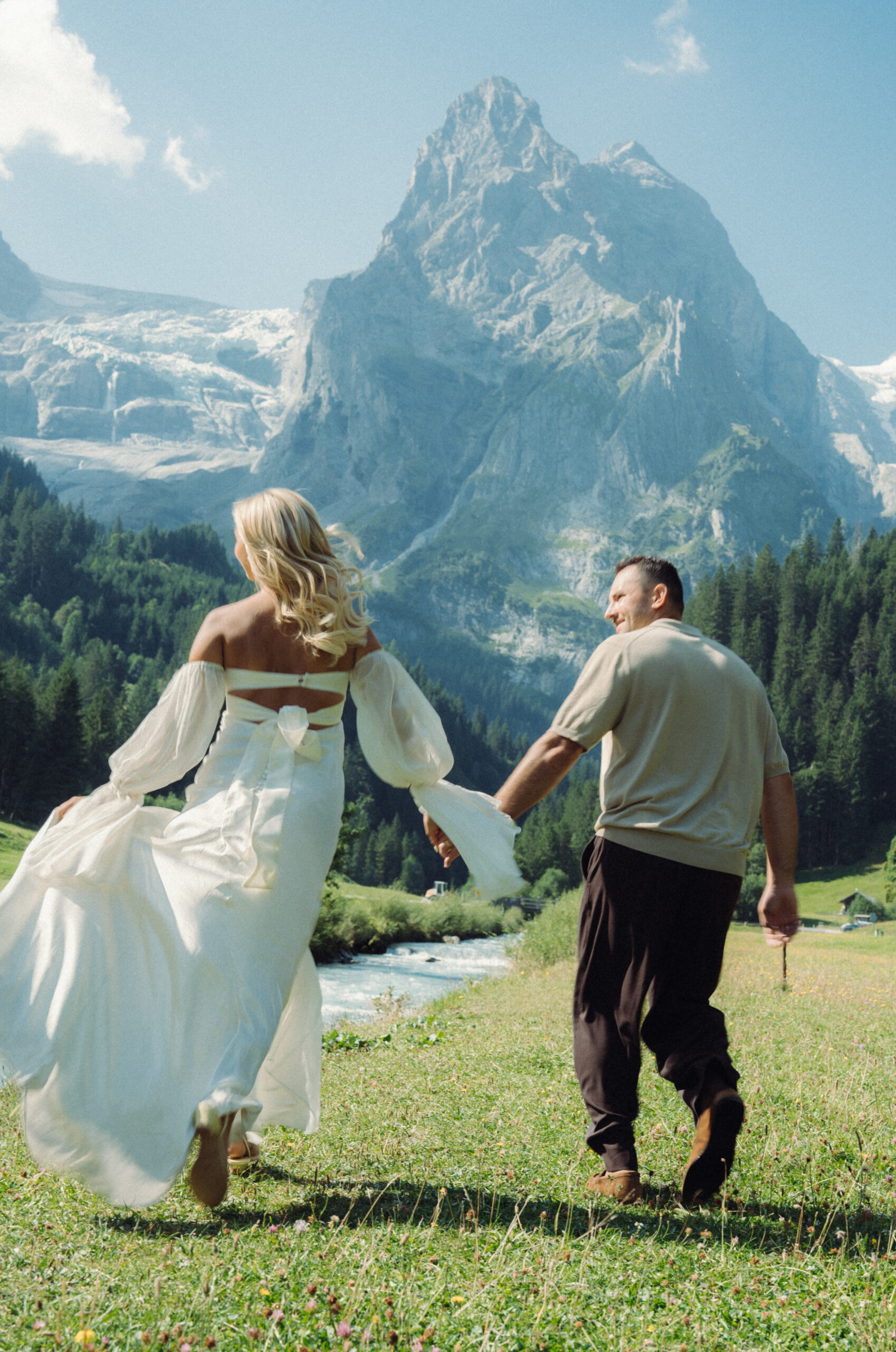 A cinematic photo of a couple taken during their mountain bridal photo shoot in Rosenlaui, Switzerland.