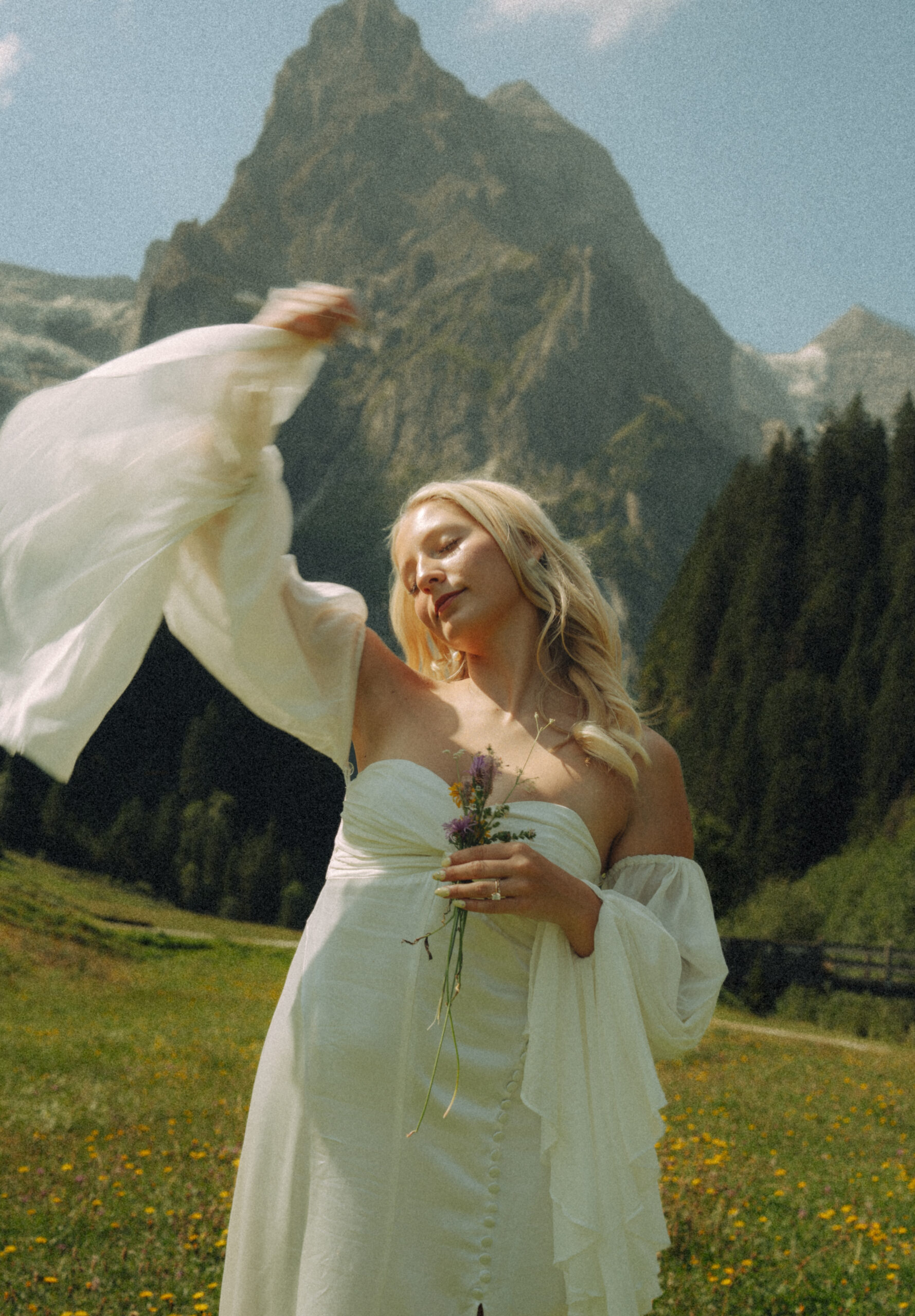 A cinematic photo of a couple taken during their mountain bridal adventure in Rosenlaui, Switzerland.