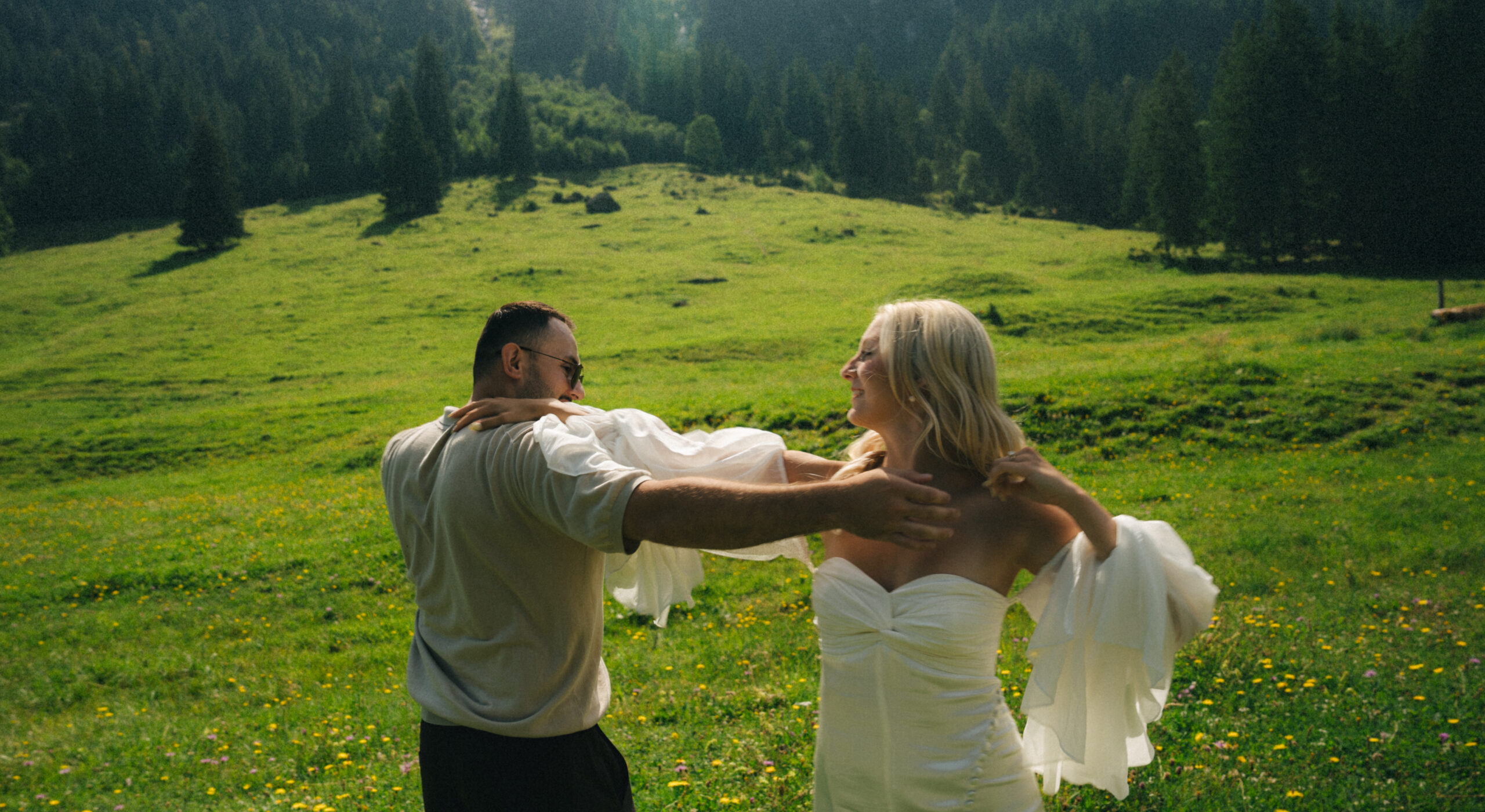 A cinematic photo of a couple taken during their mountain bridal adventure in Rosenlaui, Switzerland.