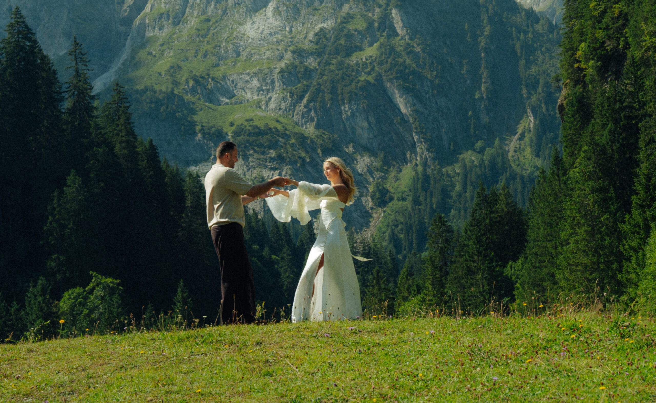A cinematic photo of a couple taken during their mountain bridal adventure in Rosenlaui, Switzerland.