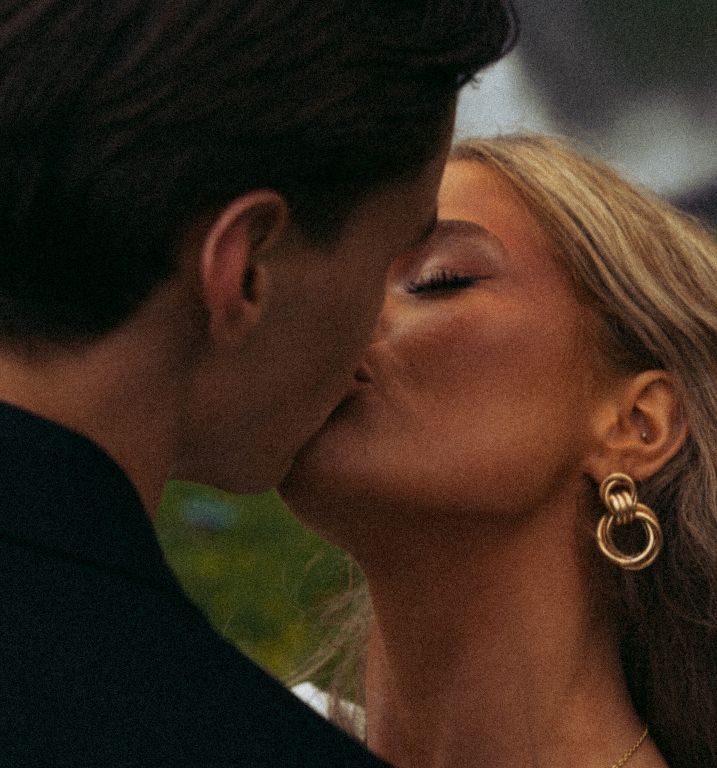 A cinematic photo of a couple in front of a waterfall during their elopement in Iceland.