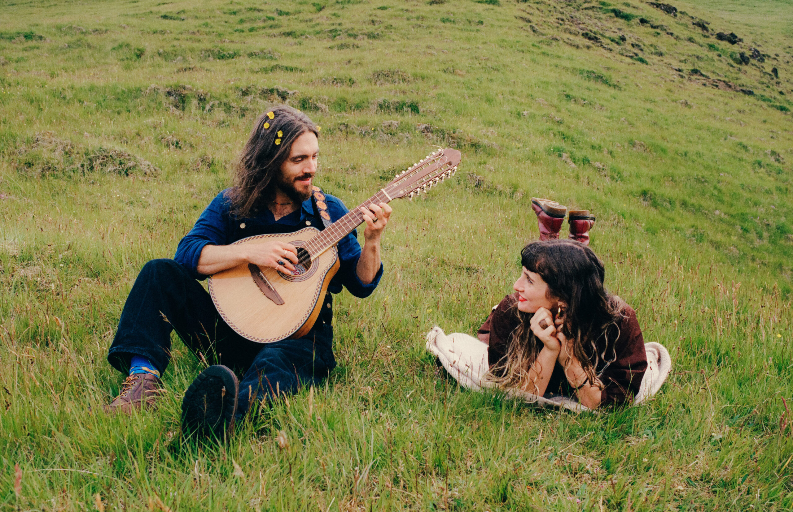 A photo of a couple near Kvernufoss in Iceland during their couple photo shoot, captured as part of their cinematic love stories.