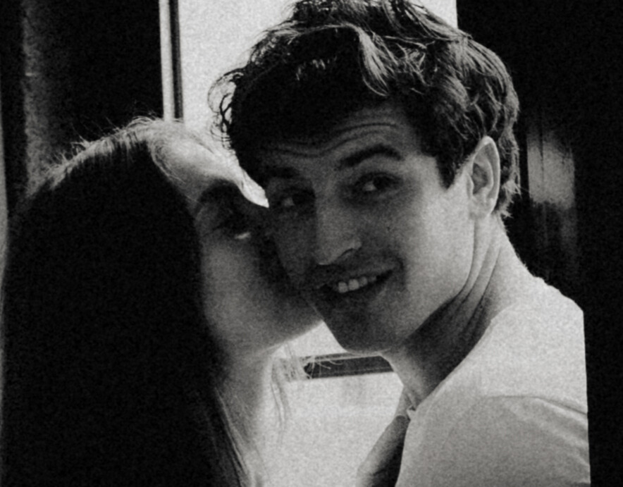 A cinematic photo of a couple posing in Porto.