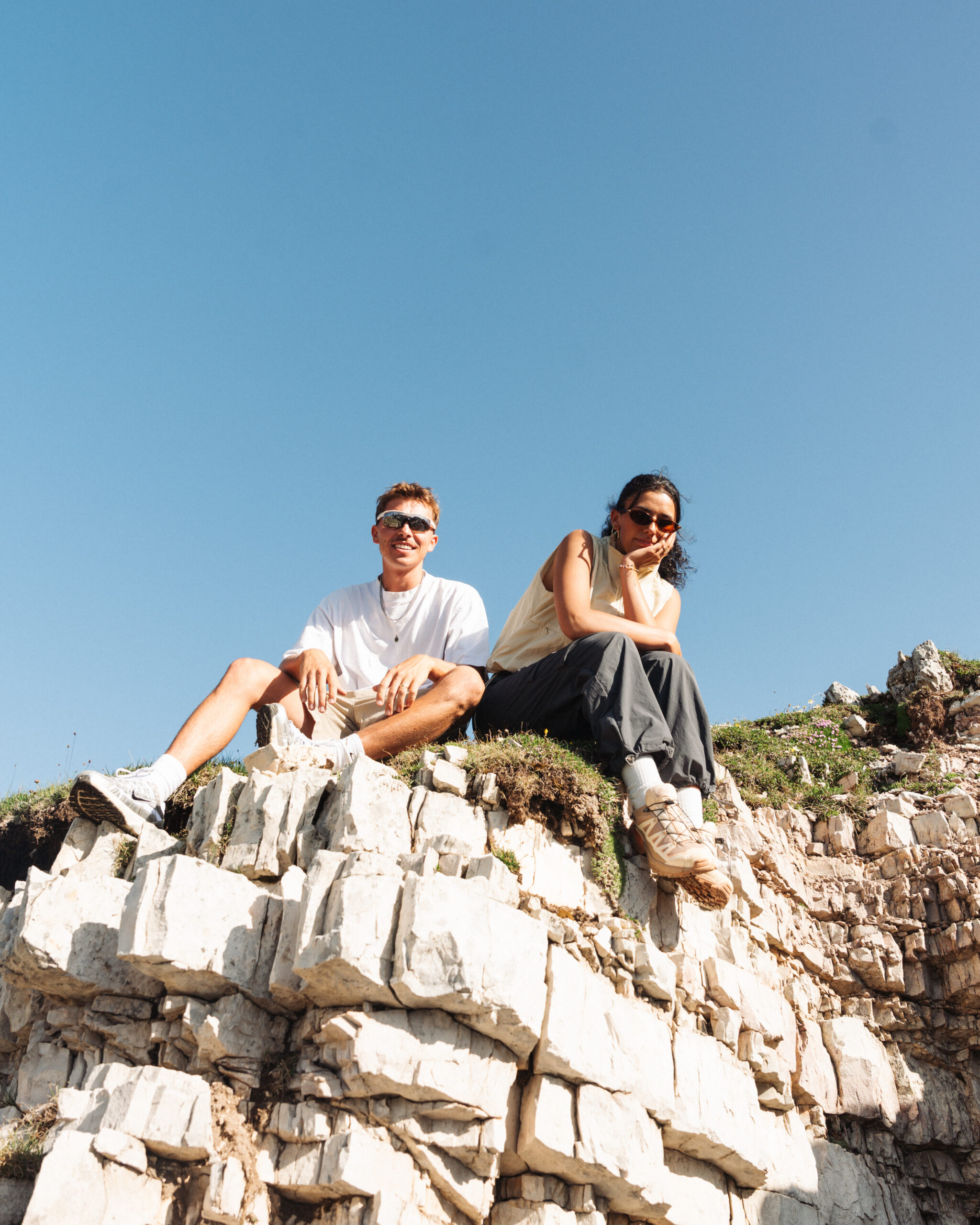 A cinematic photo of a couple posing near the Dolomites.