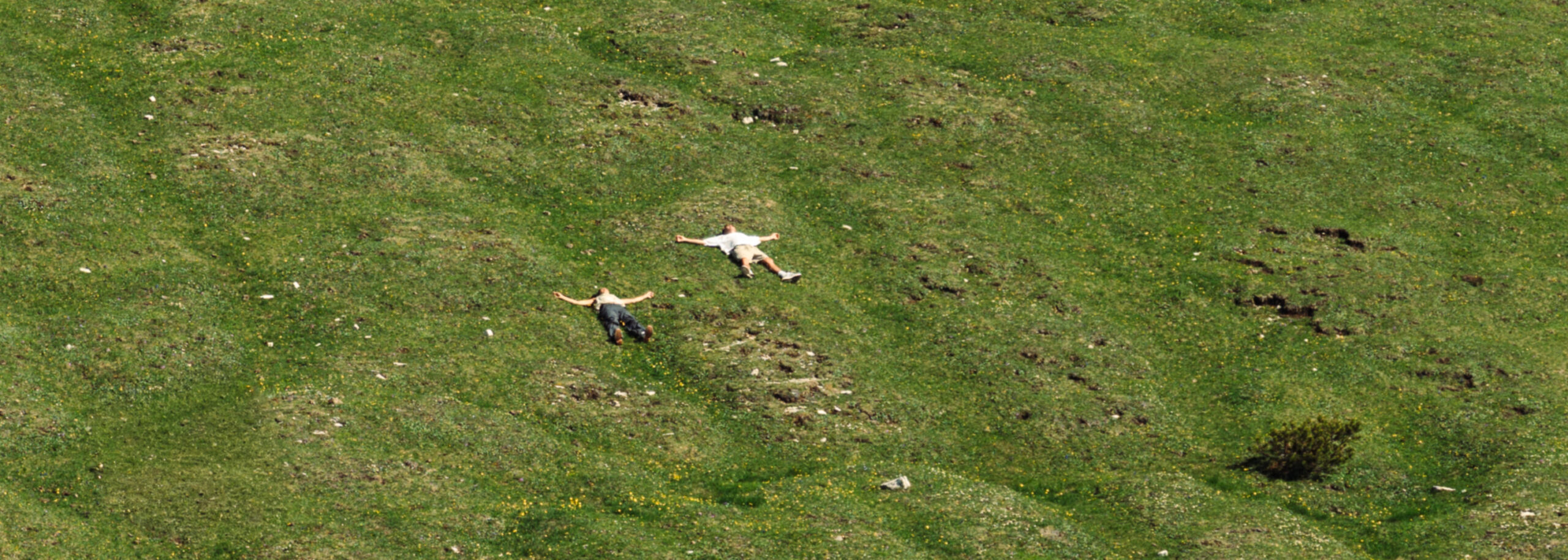 A cinematic photo of a couple posing near the Dolomites.