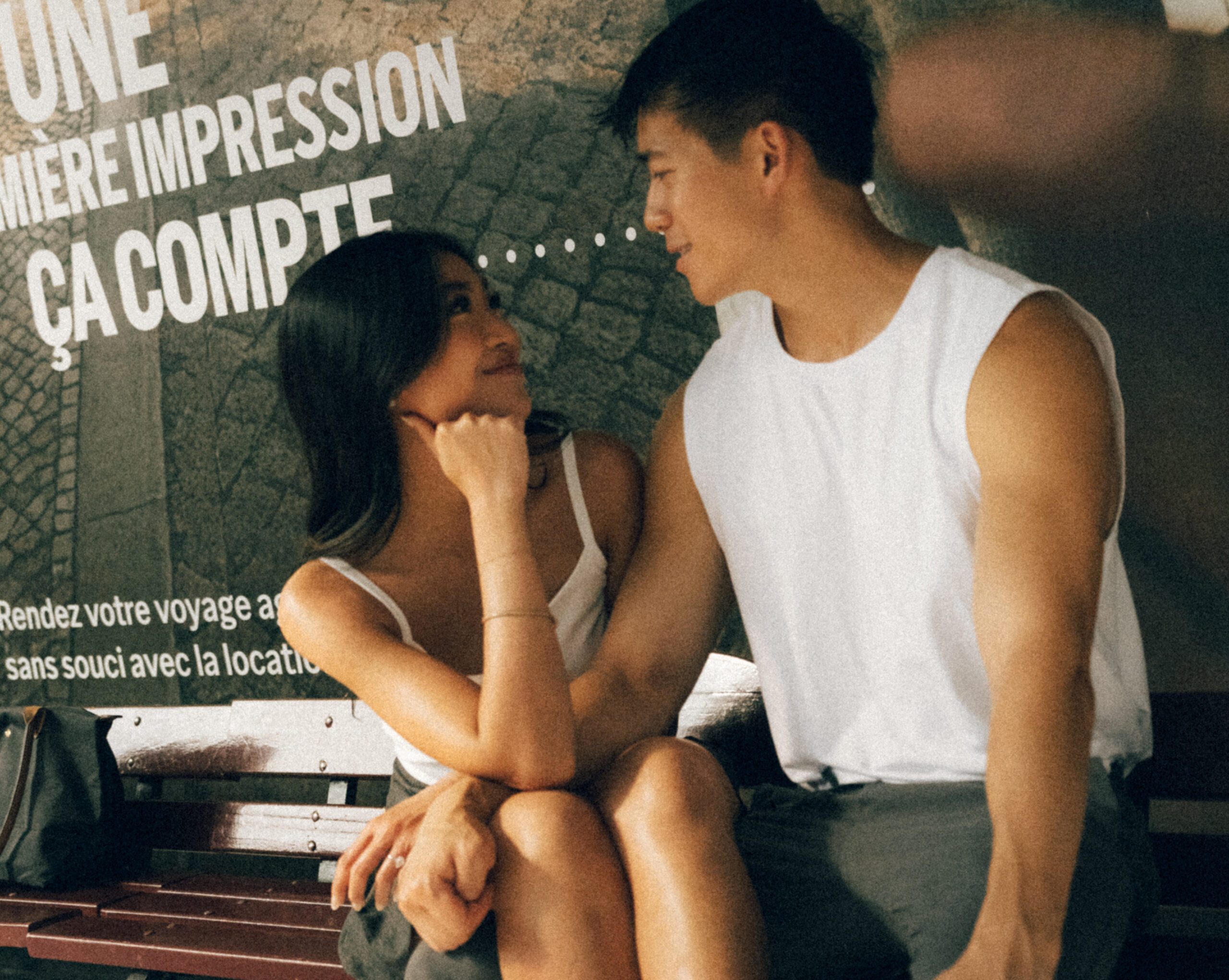 A cinematic photo of a couple posing in Paris.