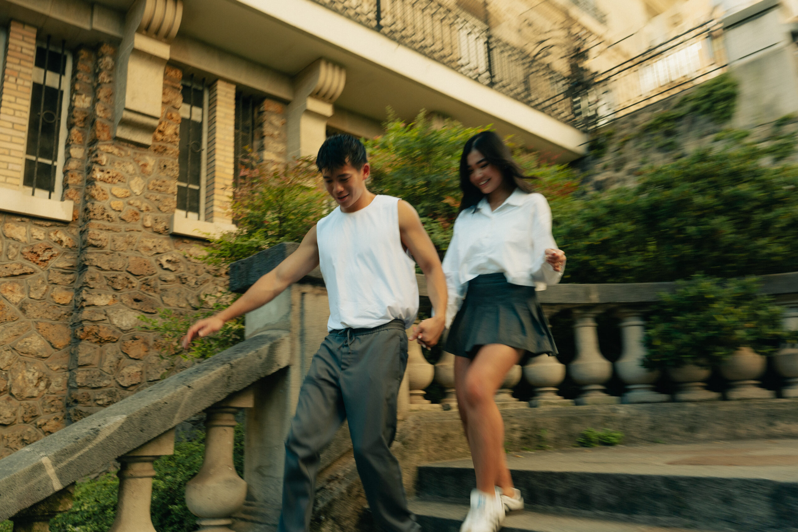 A cinematic photo of a couple posing in Paris.