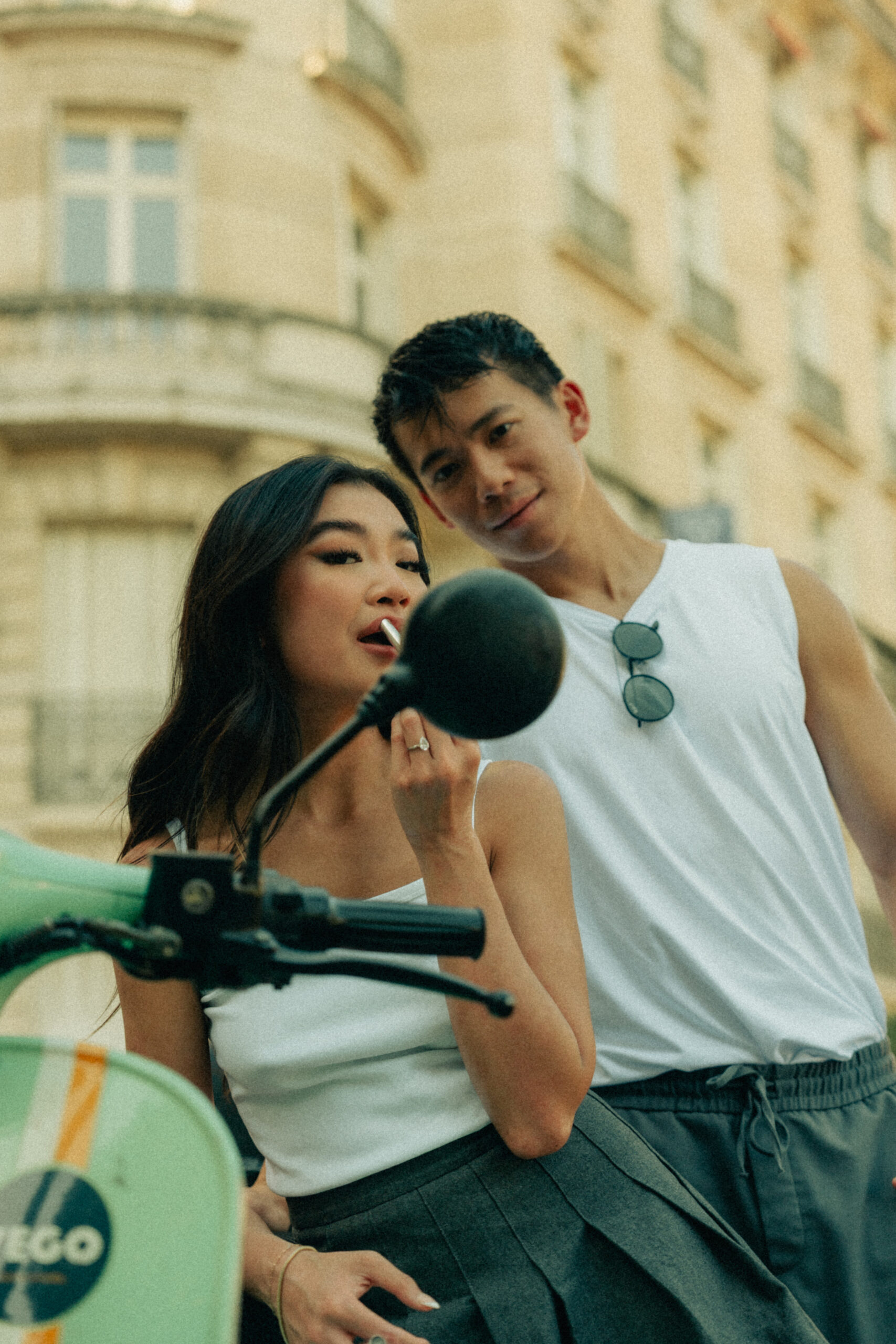 A cinematic photo of a couple posing in Paris.