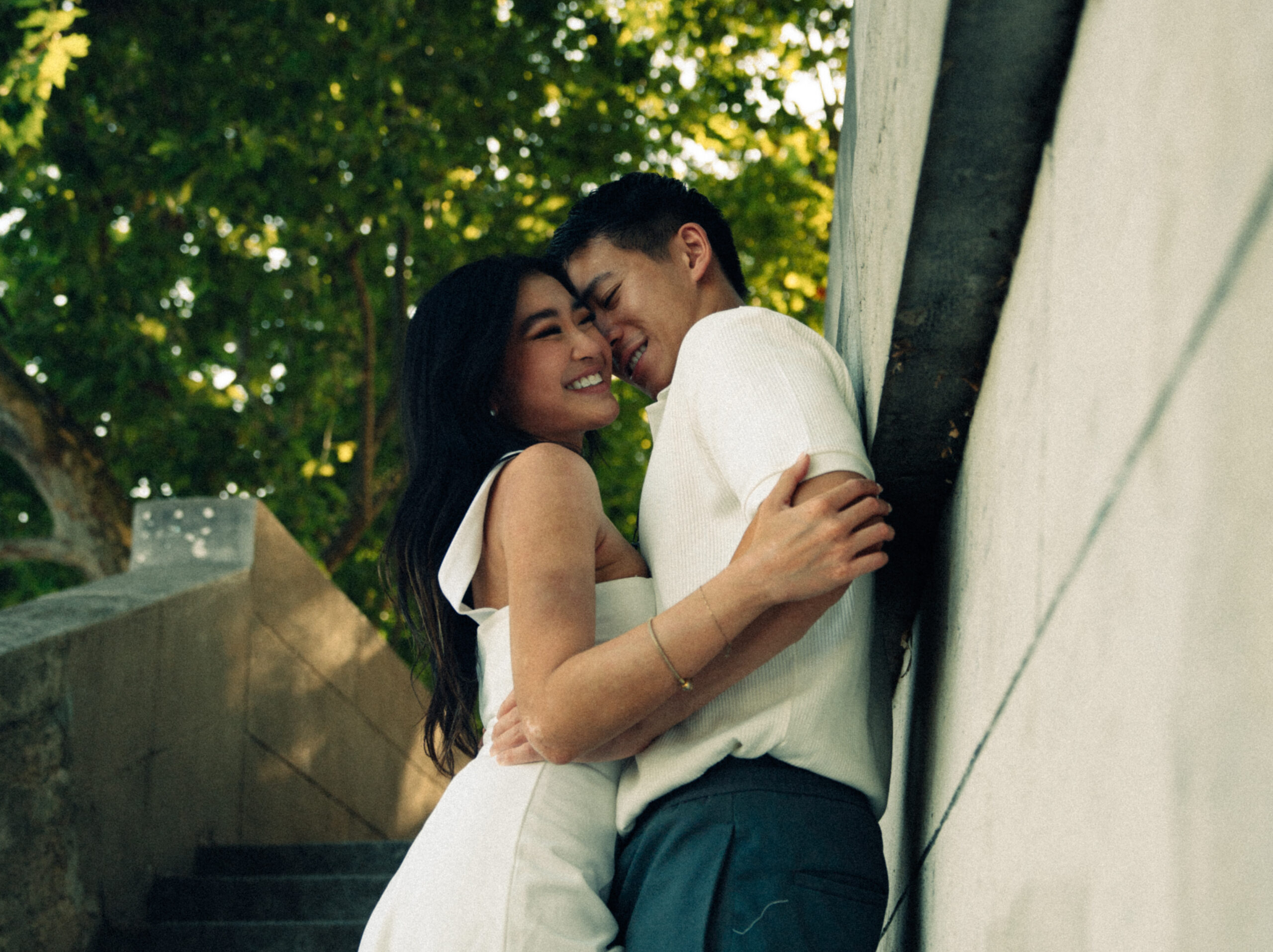 A cinematic photo of a couple posing in Paris.
