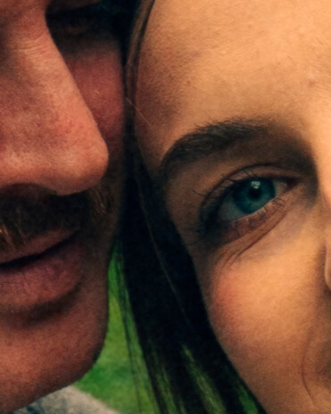 A cinematic photo of a couple at an apple orchard in the Netherlands.