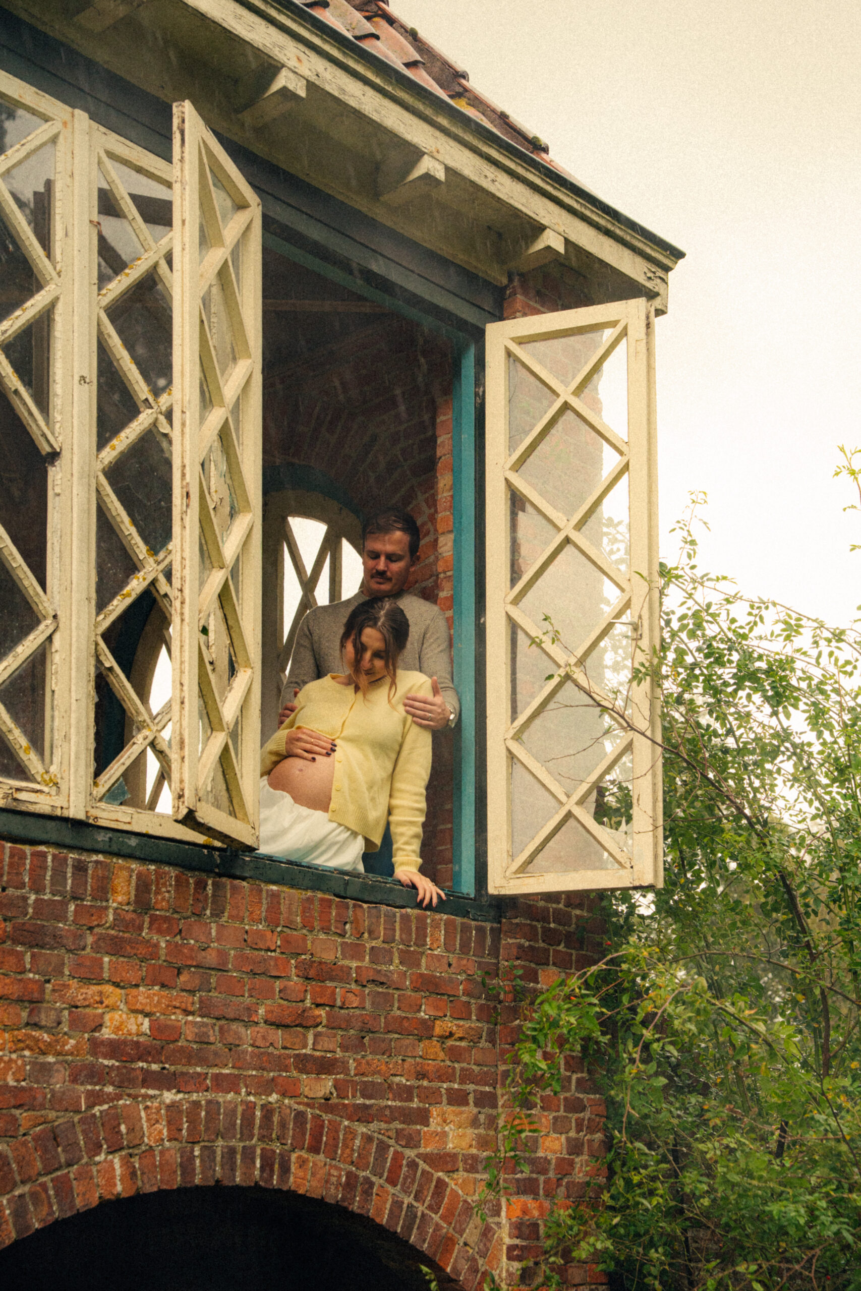 A cinematic photo of a couple at an apple orchard in the Netherlands.