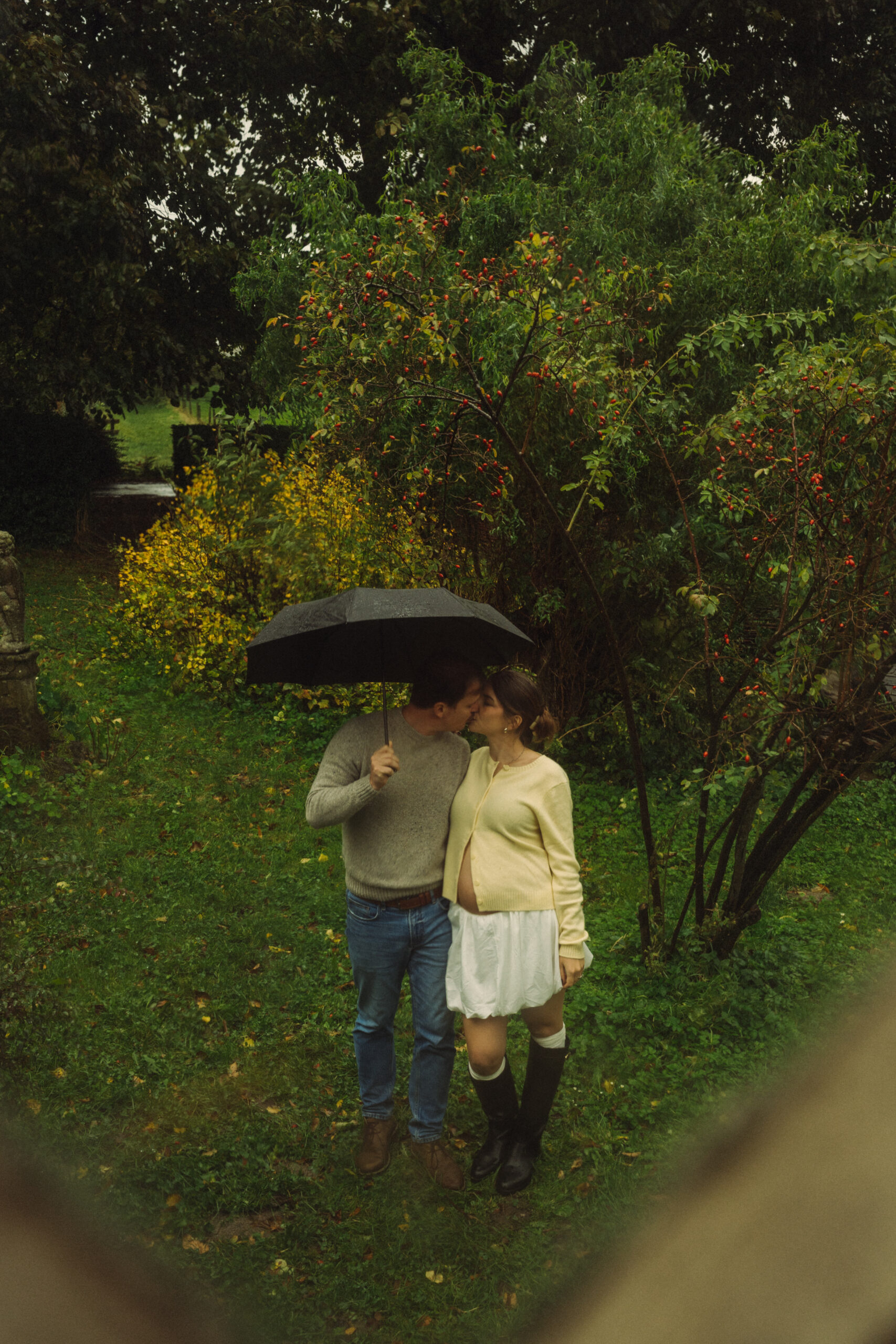 A cinematic photo of a couple at an apple orchard in the Netherlands.