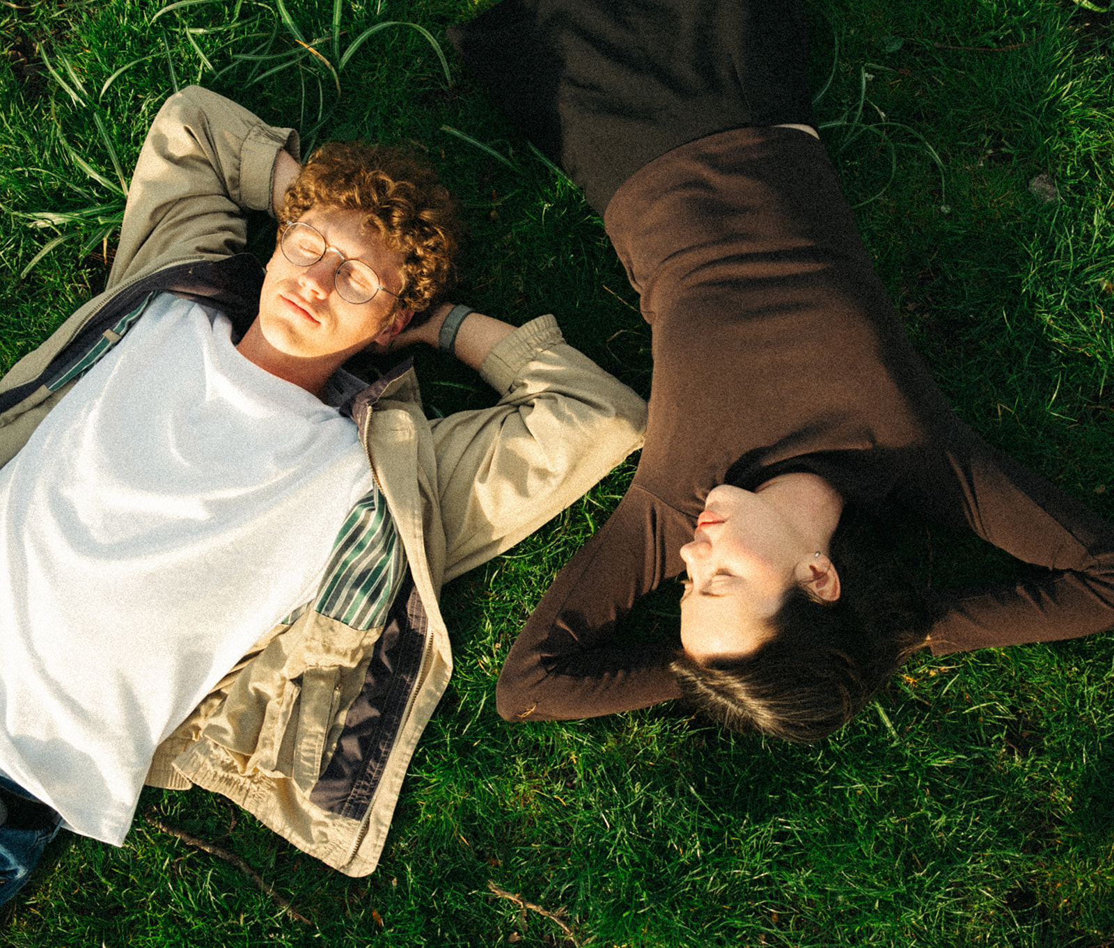 A cinematic photo of a couple in a park in Amsterdam.