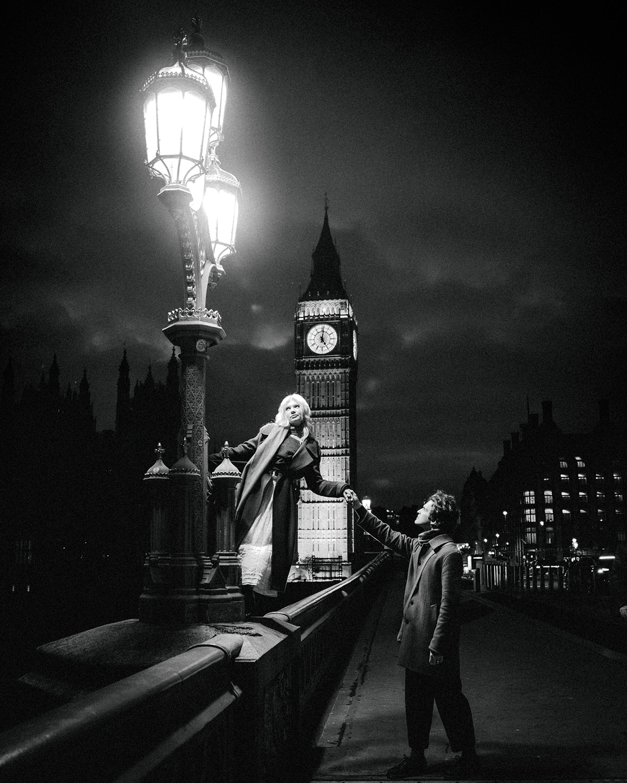 A cinematic photo of a couple posing in London.