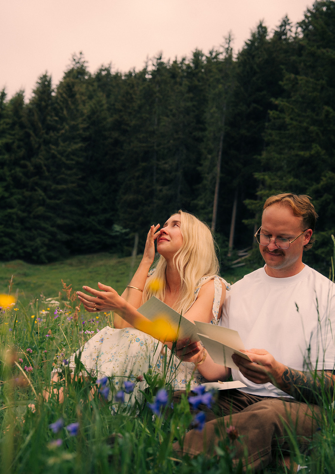 A cinematic photo of a couple reading letters near Wengen, Switzerland.