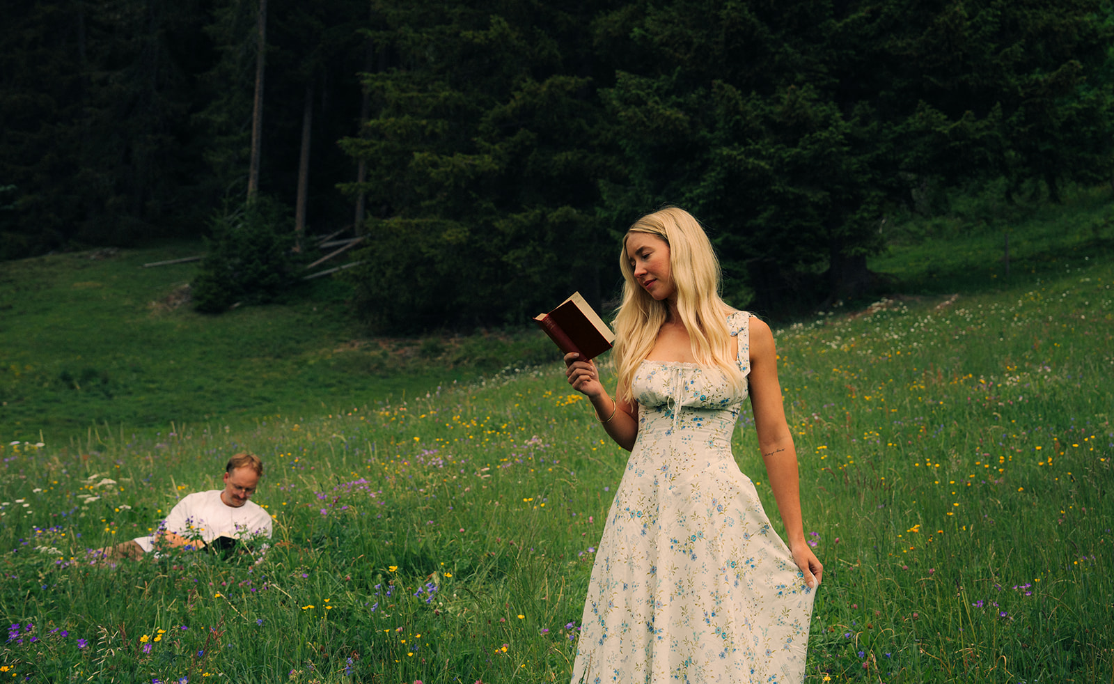 A cinematic photo of a couple posing near Wengen, Switzerland.