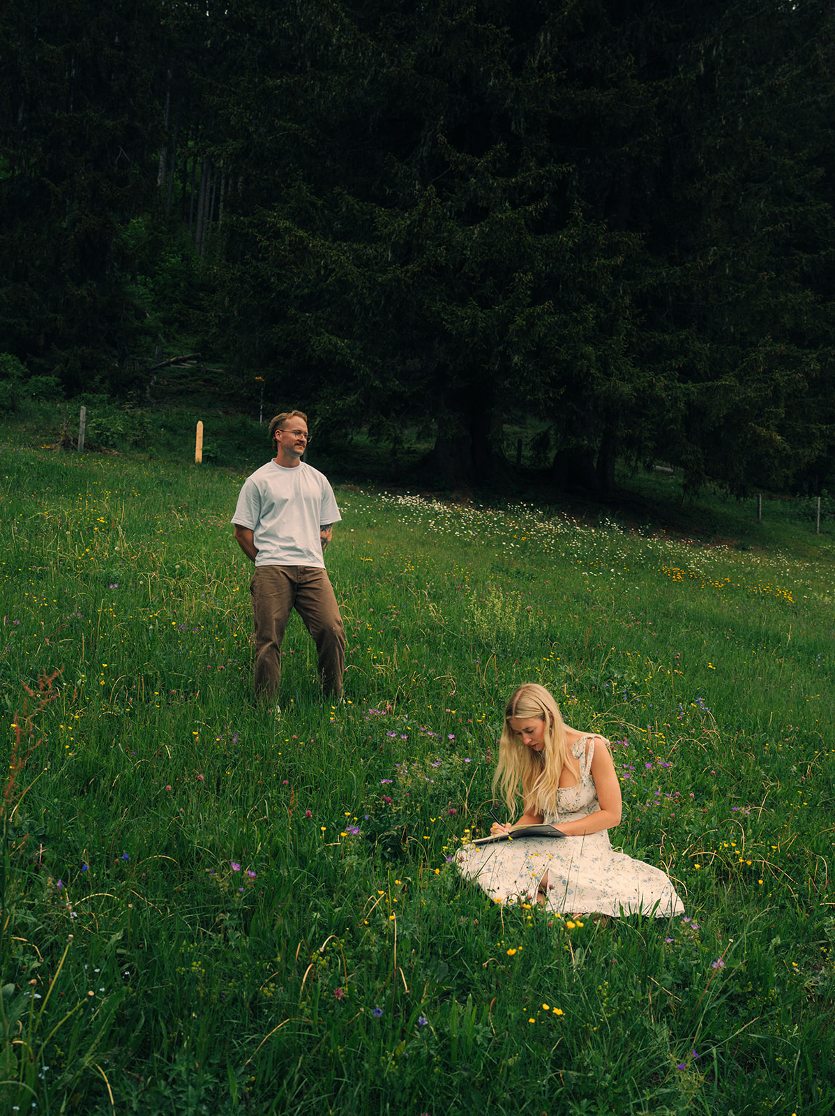 A cinematic photo of a couple posing near Wengen, Switzerland.