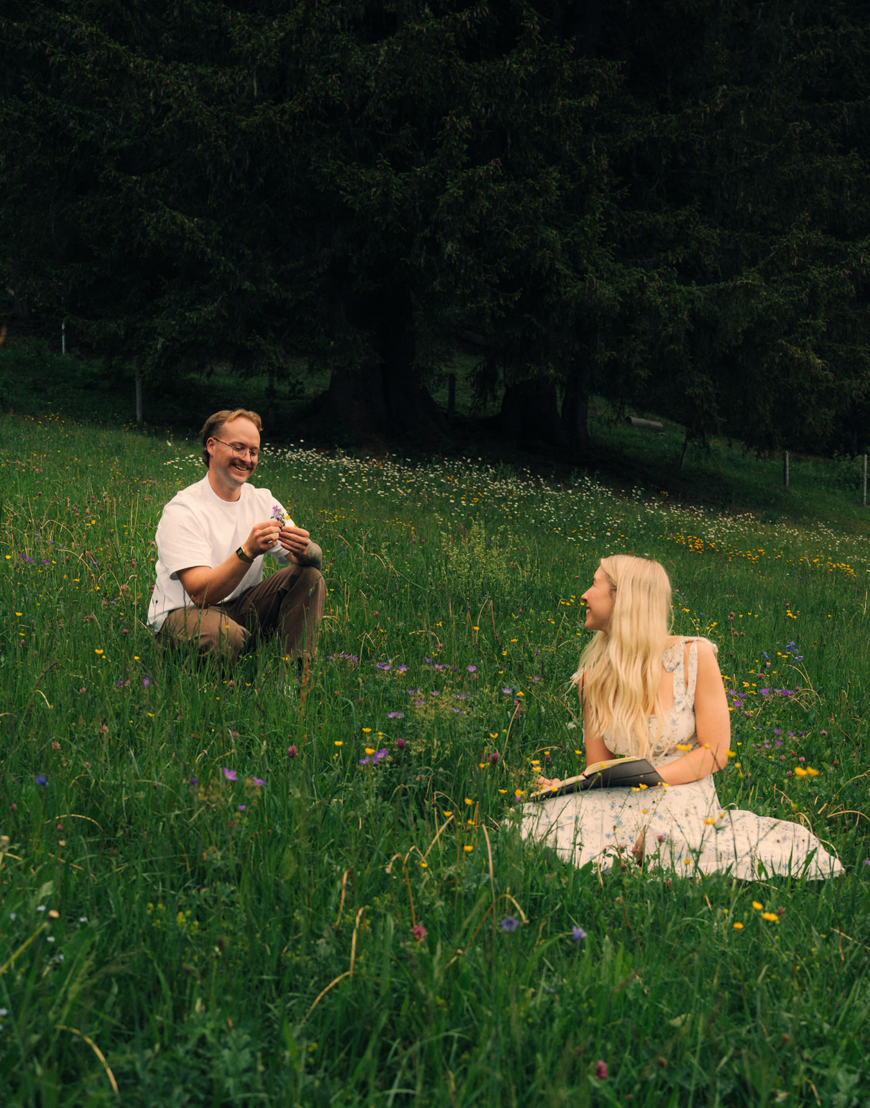 A cinematic photo of a couple posing near Wengen, Switzerland.