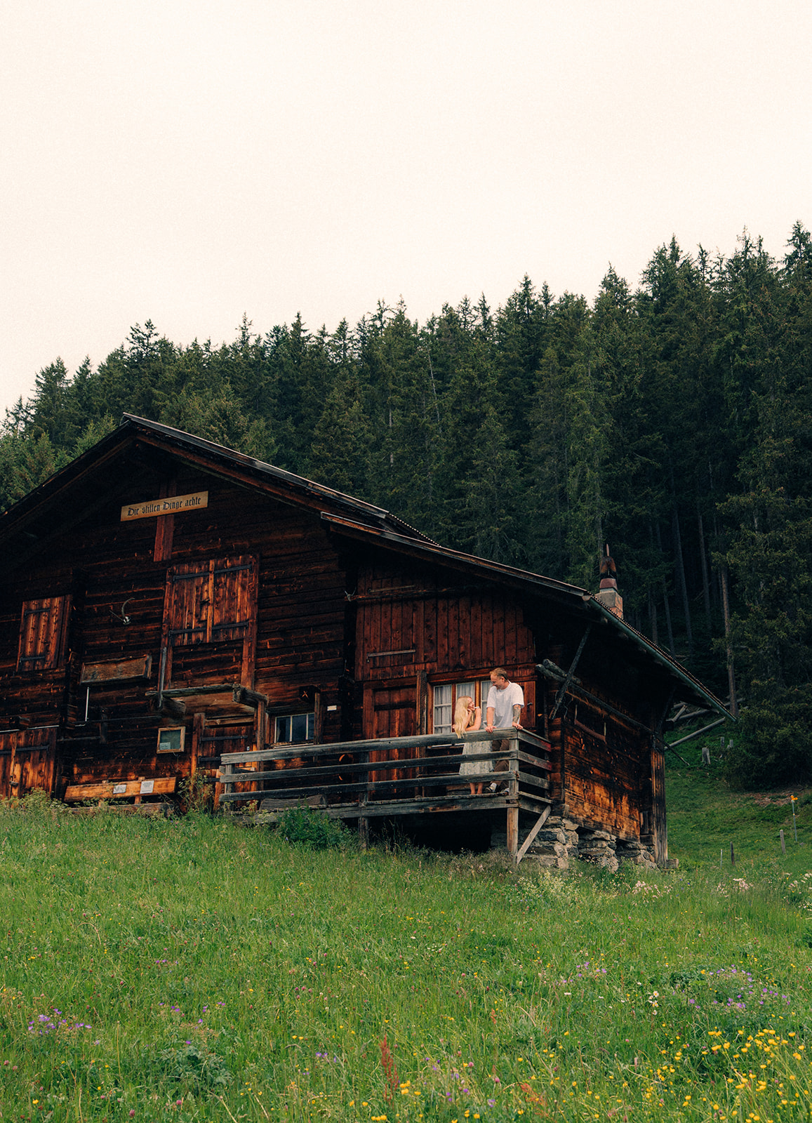 A cinematic photo of a couple posing near Wengen, Switzerland.