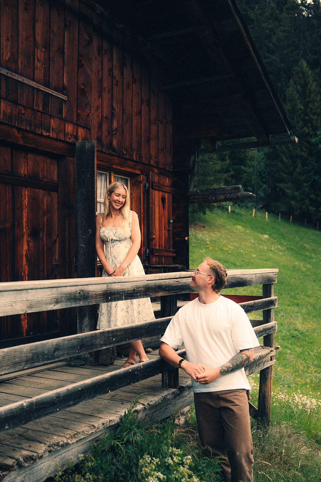 A cinematic photo of a couple posing near Wengen, Switzerland.