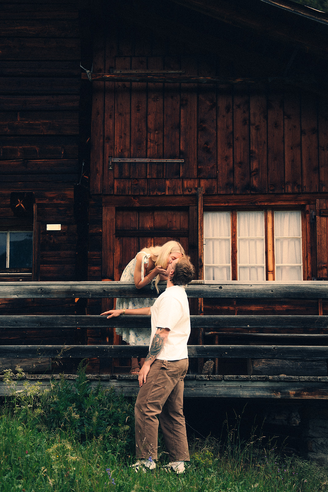 A cinematic photo of a couple posing near Wengen, Switzerland.