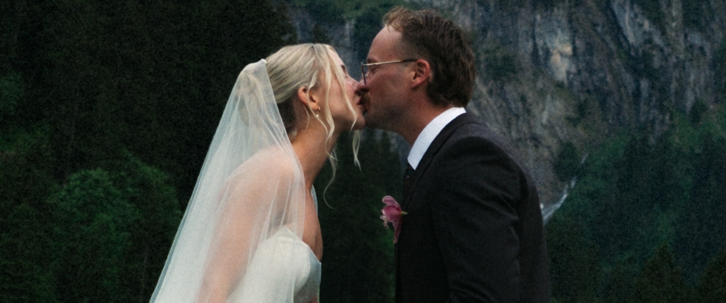 A cinematic photo of a bride and bridegroom kissing during their elopement in Rosenlaui, Switzerland.