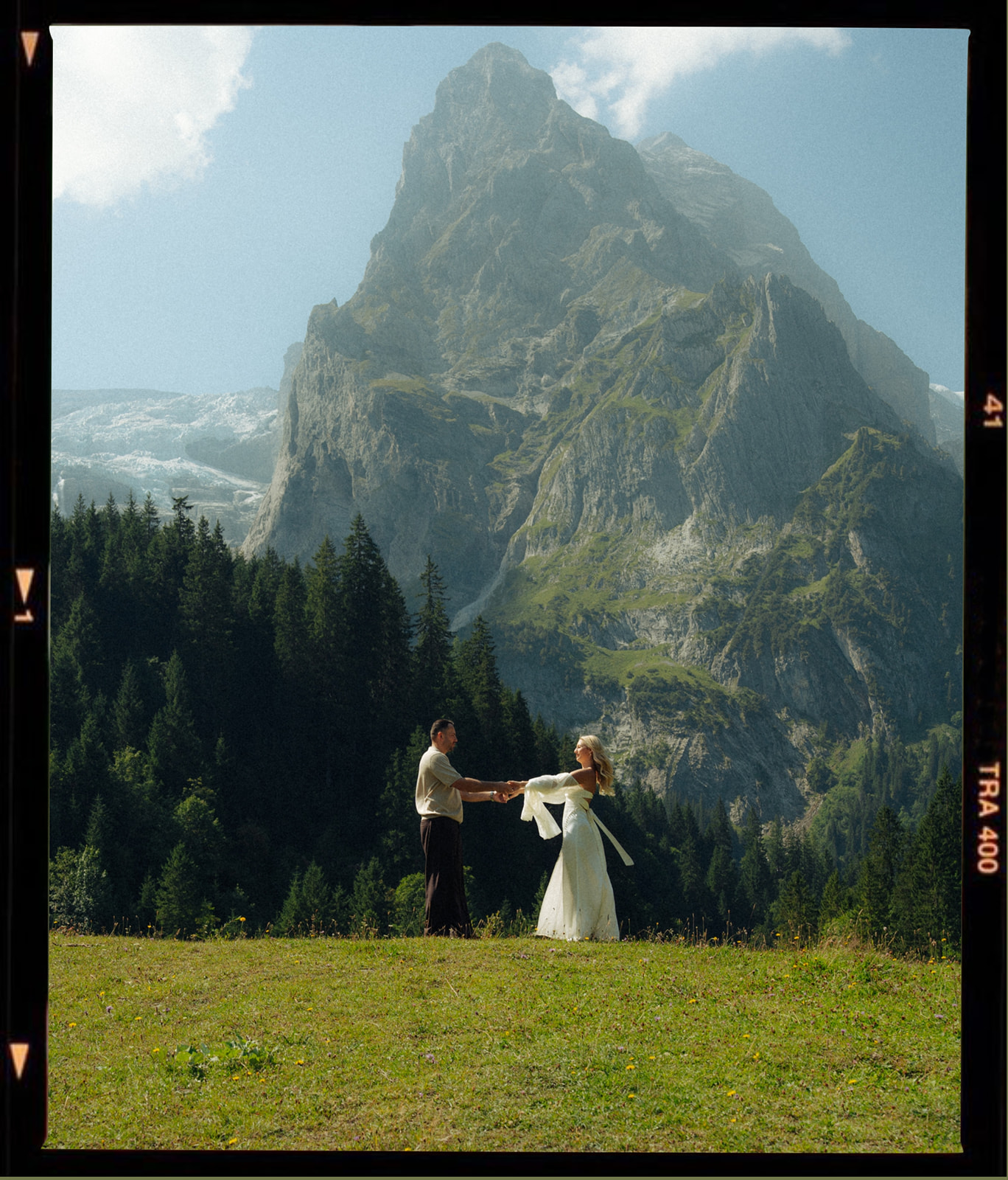 A cinematic photo of a couple taken during their mountain bridal photo shoot in Rosenlaui, Switzerland.